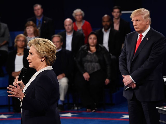 Defiant Trump seizes on Clinton sex scandal before debate