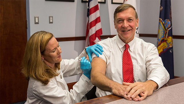 President of Stony Brook University Dr. Samuel L. Stanley Jr. receives a flu shot