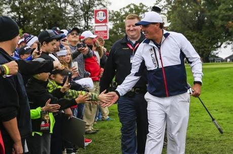 TANNEN MAURY  EPA		Phil Mickelson was among the people as he practiced Wednesday in preparation for the Ryder Cup