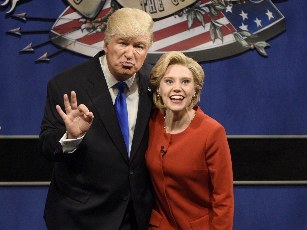 Alec Baldwin as Donald Trump and Kate Mc Kinnon as Hillary Clinton keep in character during SNL's cold open sketch that parodied Monday's presidential debate