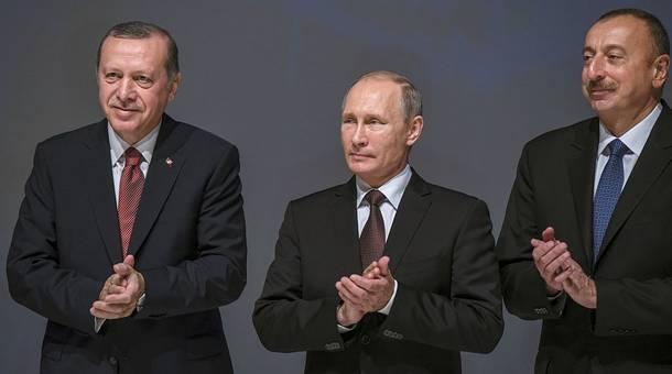 Turkey's President Recep Tayyip Erdogan Russia's President Vladimir Putin and Azerbaijan's President Ilham Aliyev applaud during the 23rd World Energy Congress on Monday in Istanbul