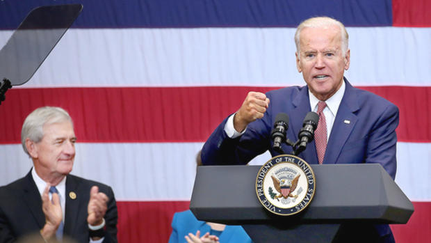 Vice President Joe Biden speaks to a crowd at UMD on Friday. Rep. Rick Nolan is at left