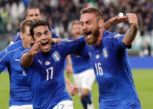 Italy's Daniele De Rossi right celebrates with teammate Eder after scoring during a World Cup Group G qualifying soccer match between Italy and Spain at the Juventus Stadium in Turin Italy Thursday Oct. 6 2016. AP