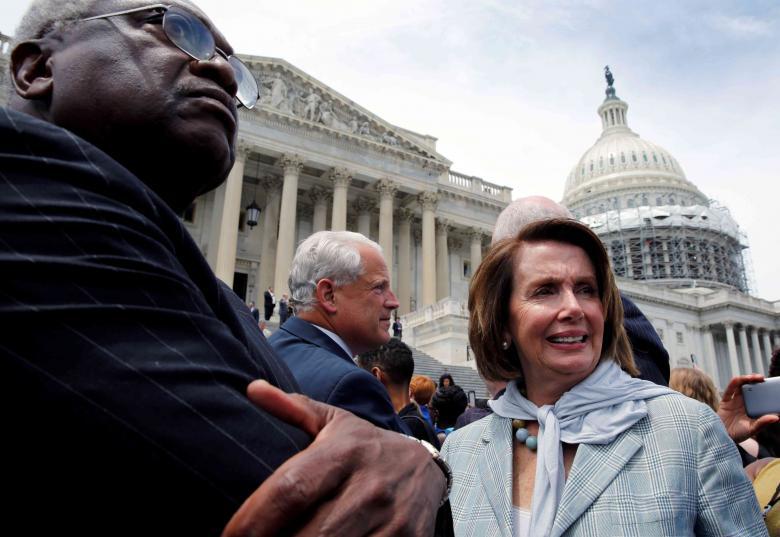 U.S. House Minority Leader Nancy Pelosi and Rep. James Clyburn walk out with House Democrats on Capitol Hill in Washington U.S. after their sit-in over gun-control law