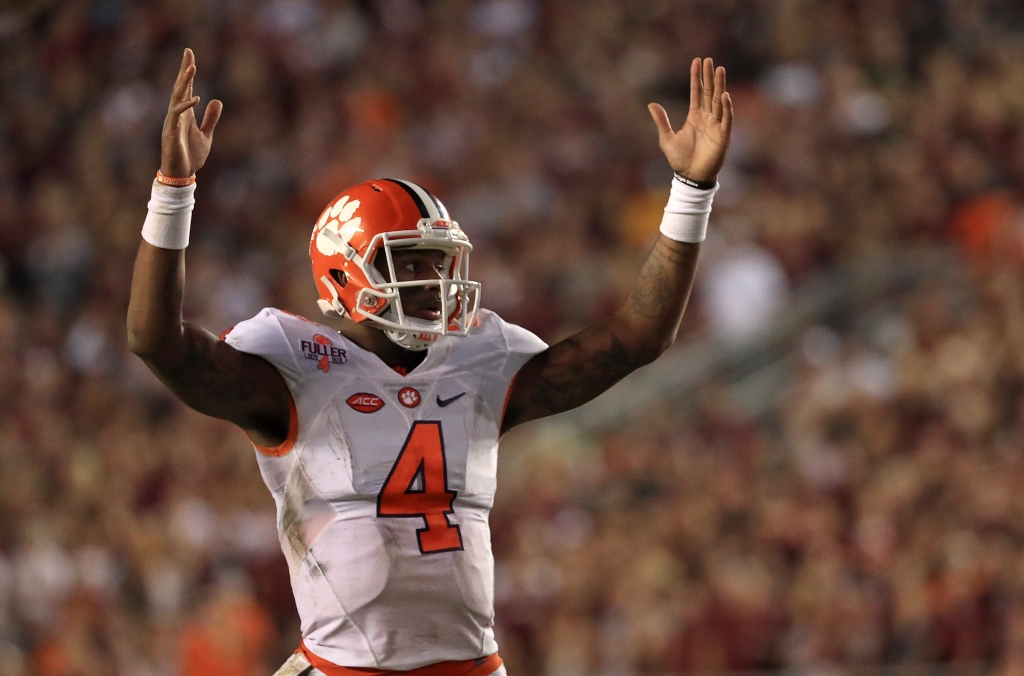 TALLAHASSEE FL- OCTOBER 29 Deshaun Watson #4 of the Clemson Tigers celebrates a touchdown during a game against the Florida State Seminoles at Doak Campbell Stadium