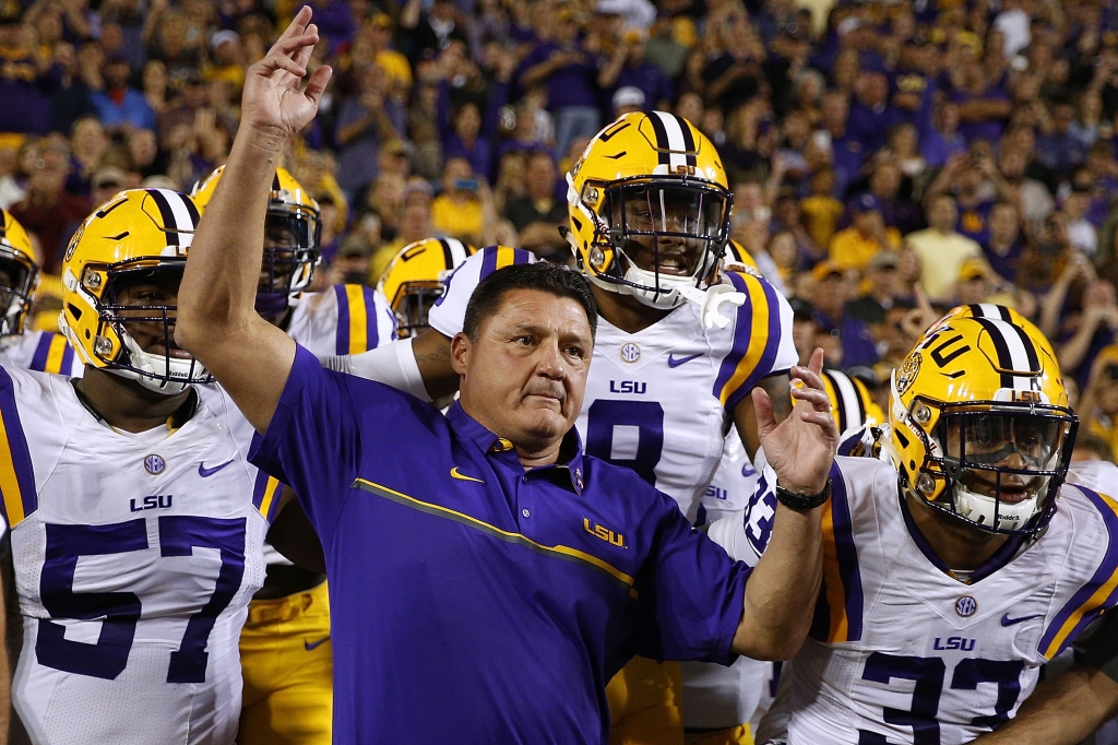 BATON ROUGE LA- OCTOBER 22 Head coach Ed Orgeron of the LSU Tigers leads his team on the field before a game against the Mississippi Rebels at Tiger Stadium