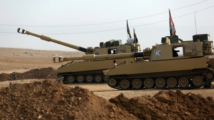 Iraqi forces prepare M109 self-propelled howitzers at a position in the village of Arbid on the southern outskirts of Mosul