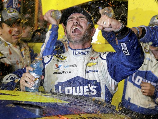 Jimmie Johnson celebrates his NASCAR Sprint Cup race and season title win