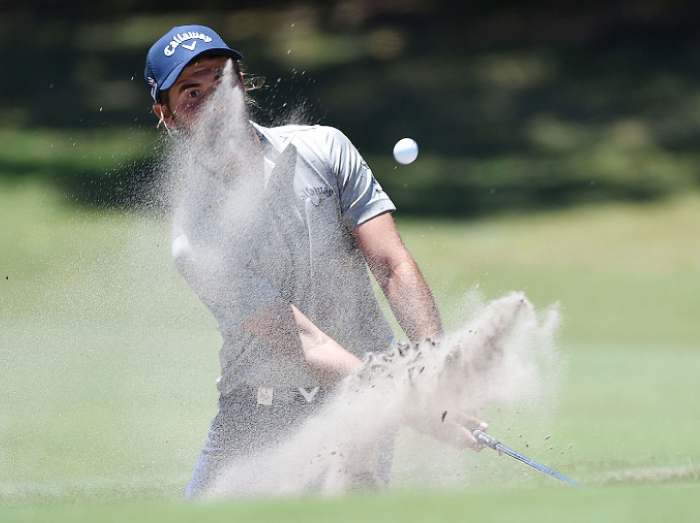 Australian golfer Curtis Luck hits the ball out of the bunker on day two of the Australian Open Golf Tournament at the Royal Sydney Golf Club in Sydney Friday. — AFP