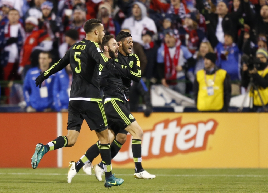 From left to right Mexico's Diego Reyes Miguel Layun and Carlos Vela celebrate their goal against the United States during the first half of a World Cup qualifying soccer match Friday Nov. 11 2016 in Columbus Ohio