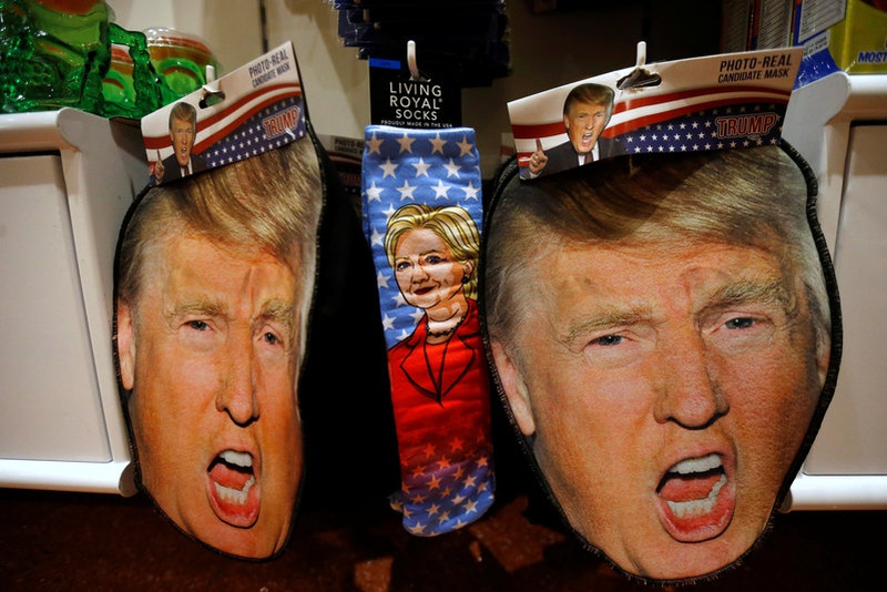 Masks depicting Republican Presidential candidate Donald Trump and socks depicting Democratic Presidential candidate Hillary Clinton are pic