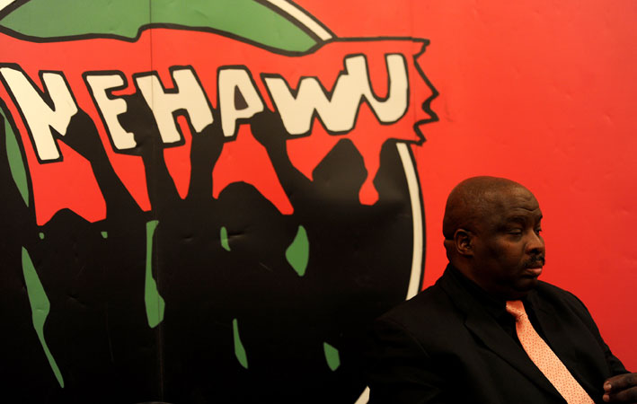 National Education Health and Allied Workers Union president Mzwandile Makwayiba fields questions from reporters in Johannesburg on Monday 3 November 2014 following its national executive committee meeting