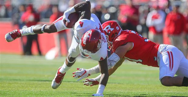 Ricky Jones maintains balance by planting his hand on the ground en route to an IU touchdown