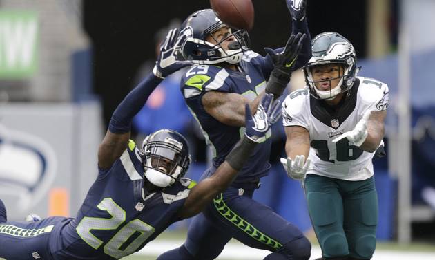 Seattle Seahawks cornerback Jeremy Lane and free safety Earl Thomas center break up a pass intended for Philadelphia Eagles wide receiver Bryce Treggs right in the first half of an NFL football game Sunday Nov. 20 2016 in Seattle. (AP