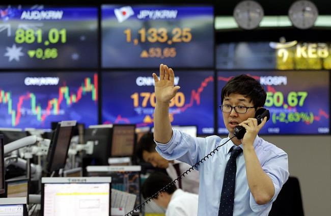 A currency trader works at the foreign exchange dealing room of the KEB Hana Bank headquarters in Seoul South Korea Wednesday Nov. 9 2016. The rising prospect of a Trump presidency jolted markets around the world Wednesday sending Dow futures and Asi