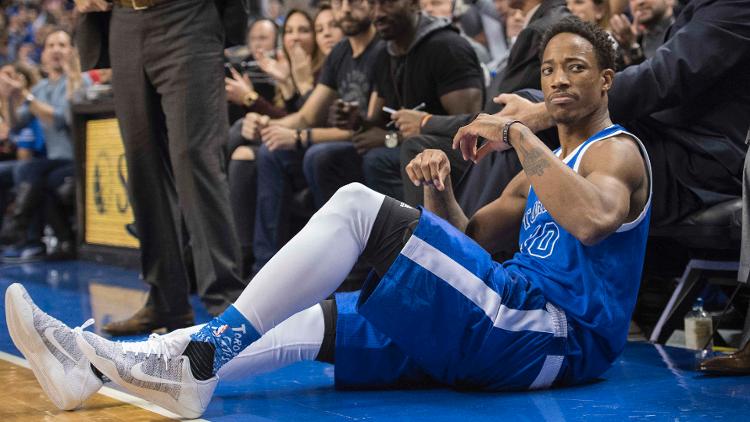 Toronto's De Mar DeRozan reacts after falling to the floor during the fourth quarter