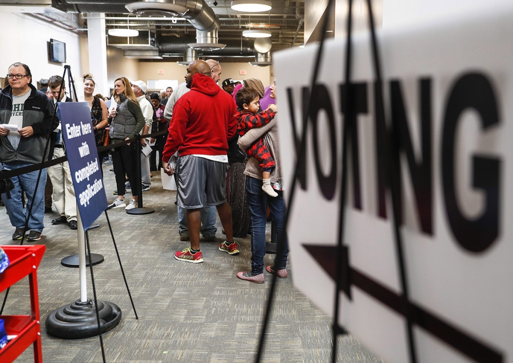 Early voters wait in line at the Franklin County Board of Elections Monday Nov. 7 2016 in Columbus Ohio