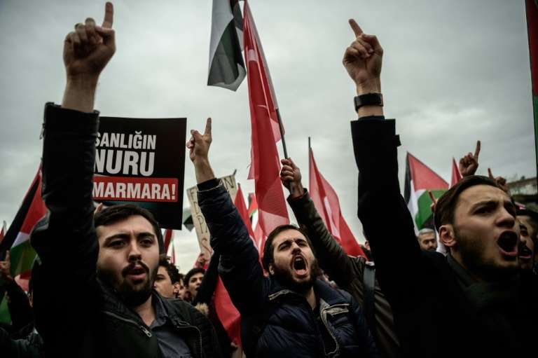 Protesters hold placards and shout anti Israeli slogans during a demonstration in Istanbul in October