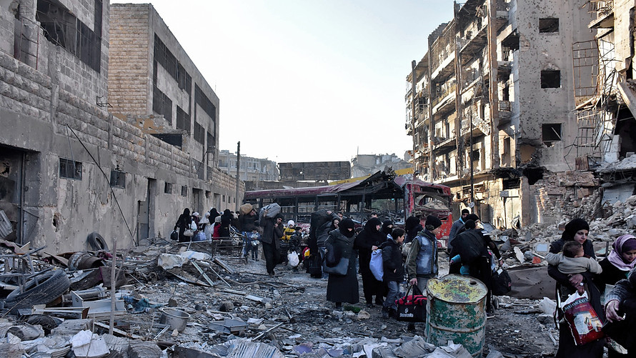 AFP  Getty Images              Residents of eastern Aleppo evacuate from their neighborhood Wednesday after it was seized by Syrian government forces