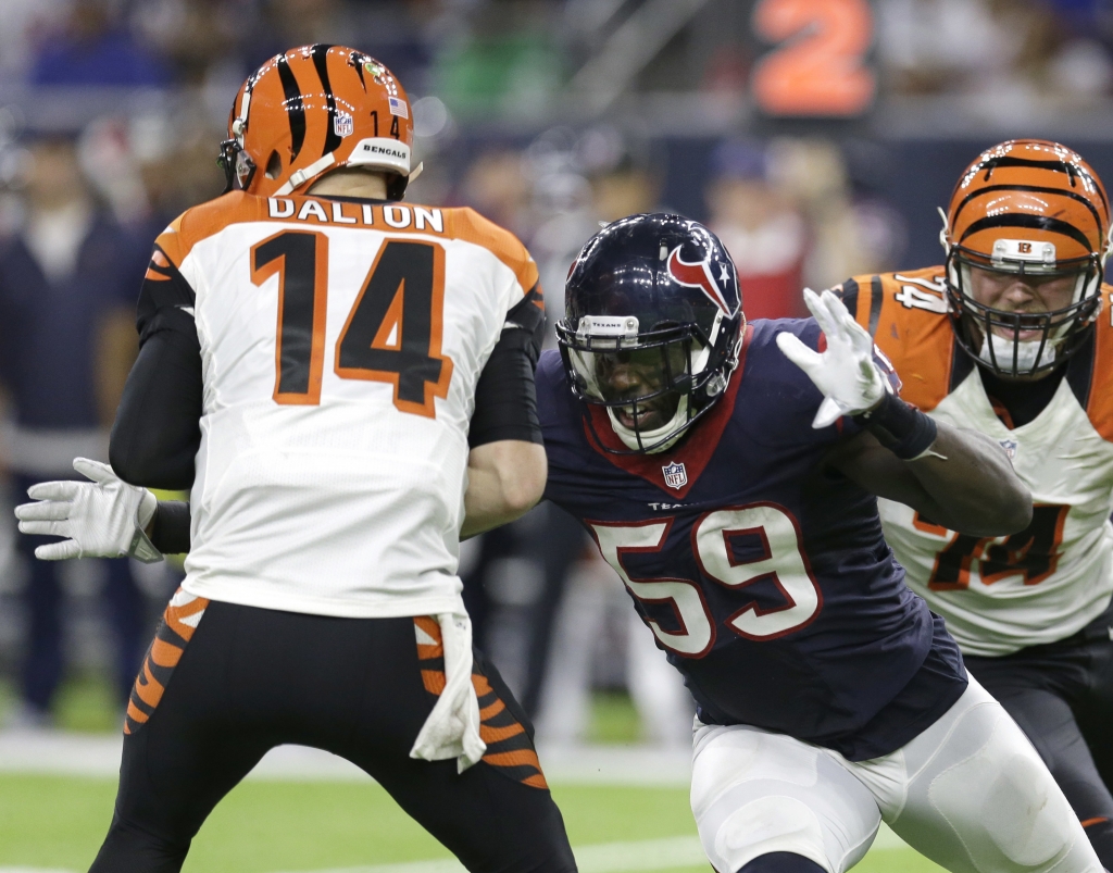 Cincinnati Bengals quarterback Andy Dalton is sacked by Houston Texans&#039 Whitney Mercilus during the second half of an NFL football game Saturday Dec. 24 2016 in Houston