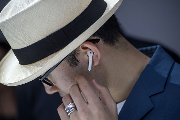 An attendee wears the Apple Inc. Air Pod wireless headphones during an event in San Francisco California U.S. on Wednesday Sept. 7 2016