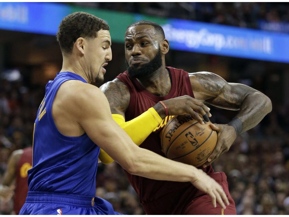 Cleveland Cavaliers&#039 Le Bron James right drives to the basket against Golden State Warriors&#039 Klay Thompson in the first half of an NBA basketball game Sunday Dec. 25 2016 in Cleveland. The Cavaliers won 109-108