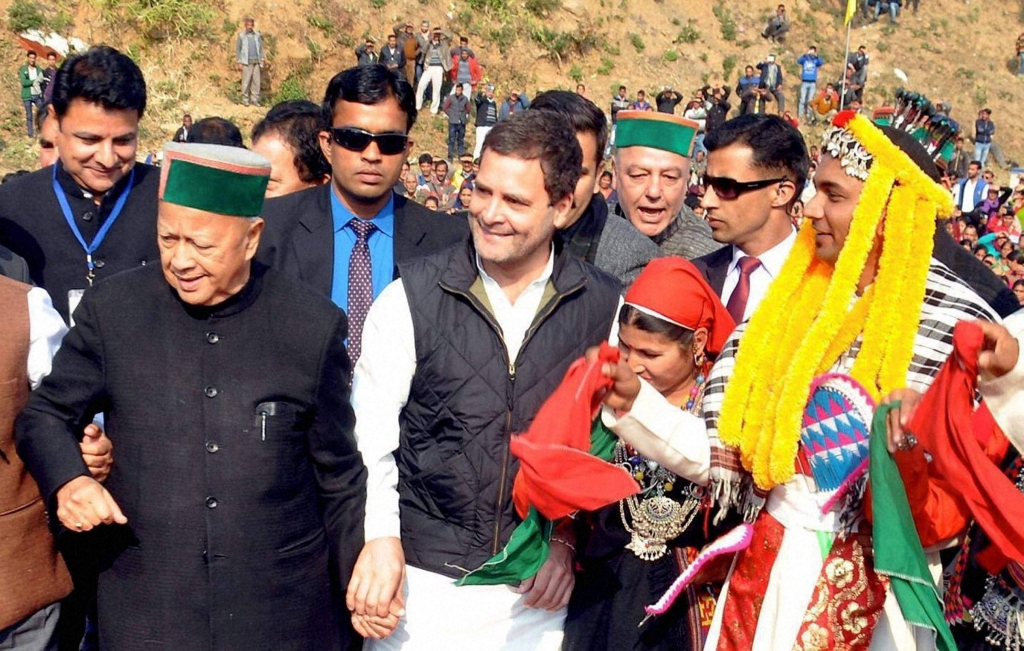 Chief Minister Virbhadra Singh and Congress vice-president Rahul Gandhi dance with Kullu artistes during a rally at Dharamsala on Saturday | PTI