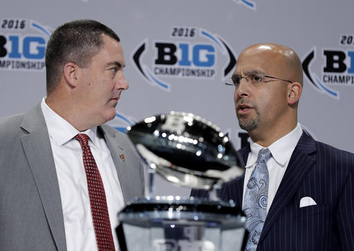 Wisconsin head coach Paul Chryst talks with Penn State head coach James Franklin during a news conference for the Big Ten Conference championship NCAA college football game Friday Dec. 2 2016 in Indianapolis. Wisconsin