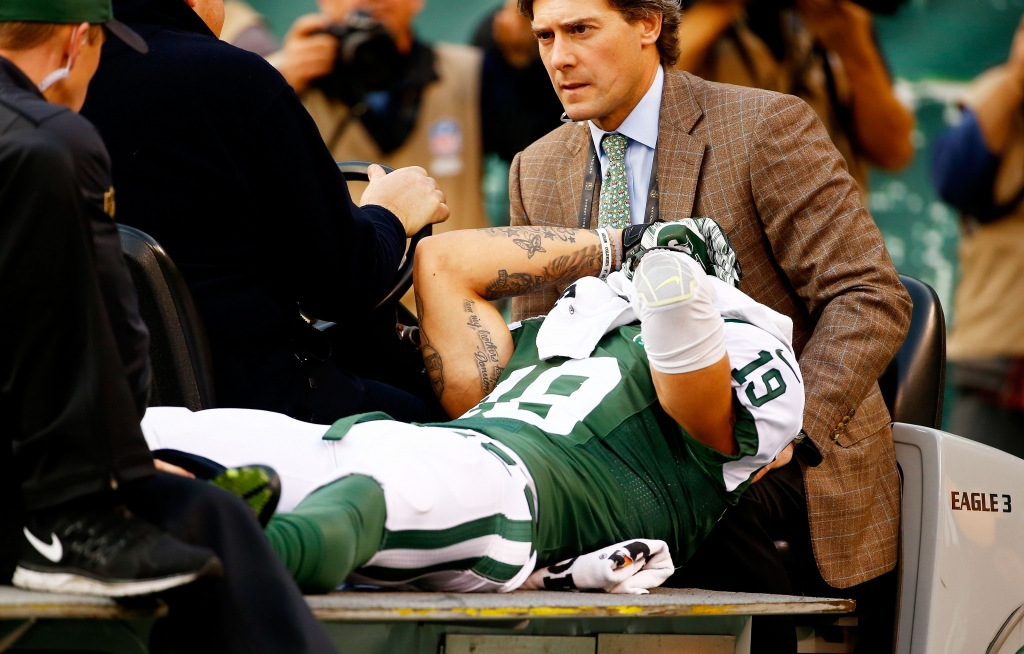 Jets wide receiver Devin Smith is carted off the field after an injury in a December 2015 game against the