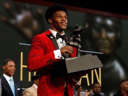 Louisville QB Lamar Jackson with the Heisman Trophy