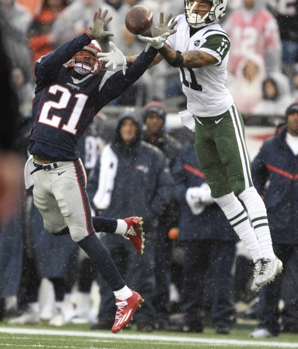 Dec 24 2016 Foxborough MA USA New England Patriots cornerback Malcolm Butler intercepts a pass intended for New York Jets wide receiver Robby Anderson during the first half at Gillette Stadium. Mandatory Credit Bob DeChiara-USA TODAY Sport