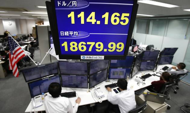 A monitor shows the current exchange rate between Japanese yen and U.S. dollar top and Nikkei stock index bottom at a foreign exchange brokerage in Tokyo Thursday Dec. 1 2016. Asian stock markets moved mostly higher on Thursday as upbeat factory dat