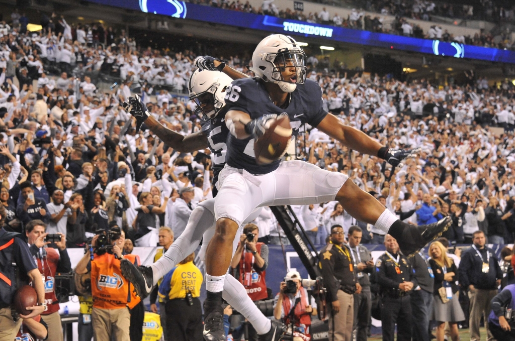 20161203lf_PSU21-1 Penn State running back Saquon Barkley celebrates after scoring against Wisconsin in the fourth quarter of the Big Ten Championship game at Lucas Oil Stadium in Indianapolis on Saturday