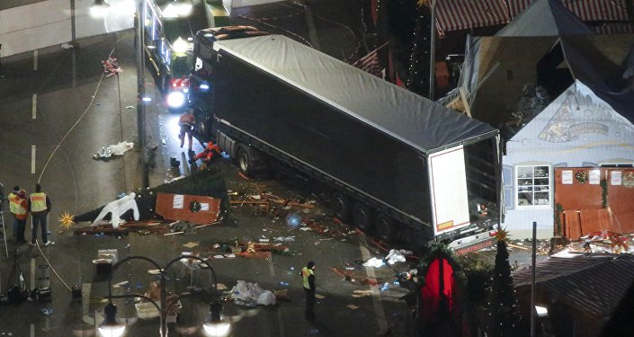 A used suit of a forensic investigator lies on a Christmas tree where a truck ploughed through a crowded Christmas market killing 12 people in the west of Berlin Germany