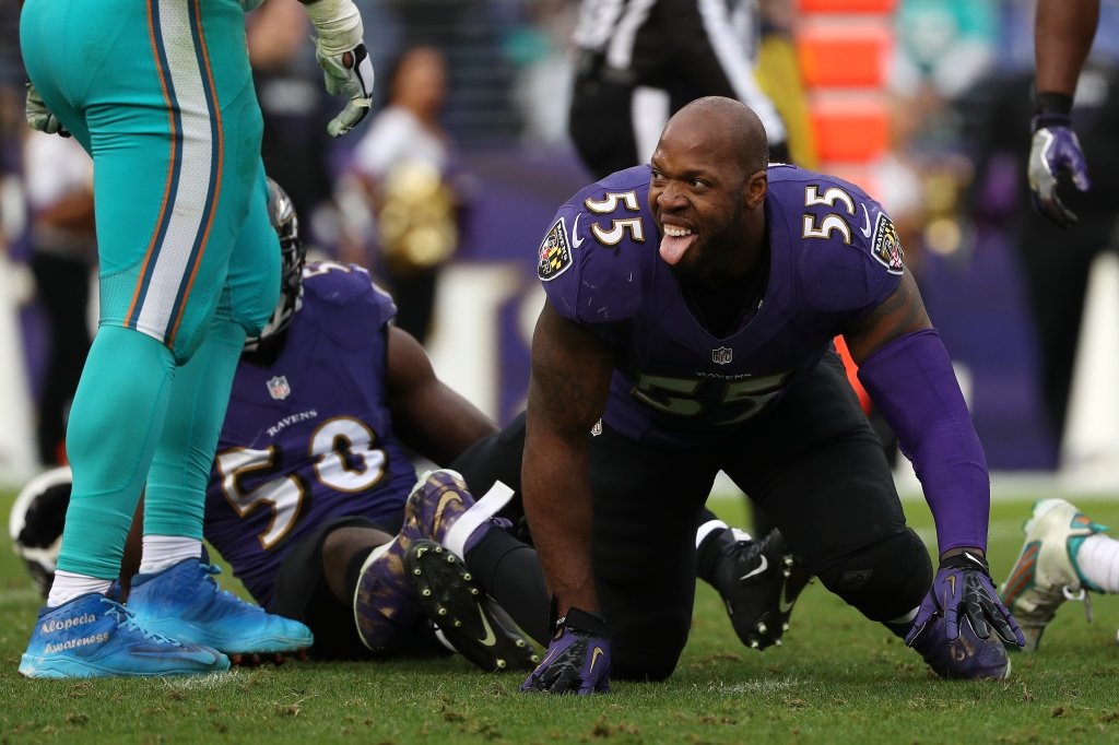 BALTIMORE MD- DECEMBER 4 Outside linebacker Terrell Suggs #55 of the Baltimore Ravens reacts after hitting quarterback Ryan Tannehill #17 of the Miami Dolphins in the third quarter at M&T Bank Stadium