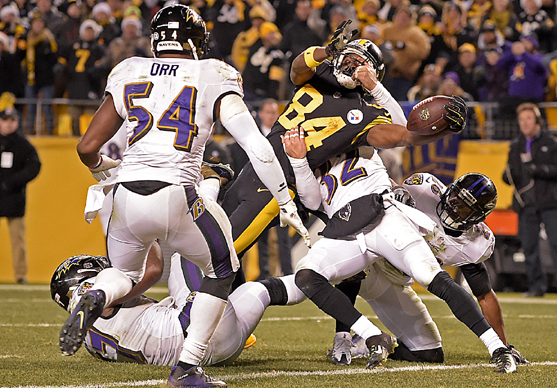 Pittsburgh Steelers wide receiver Antonio Brown reaches the ball across the goal line for the winning touchdown during the second half of Sunday's game against the Baltimore Ravens in Pittsburgh. The Steelers won 31-27