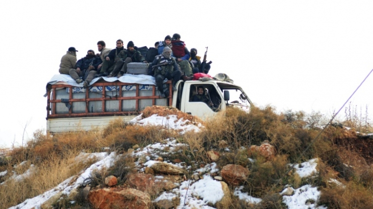 Syrian rebel fighters are evacuated from Aleppo towards rebel-held territory