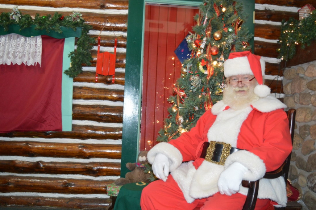 Santa Claus sits at Santa’s Workshop in North Pole New York on Tuesday