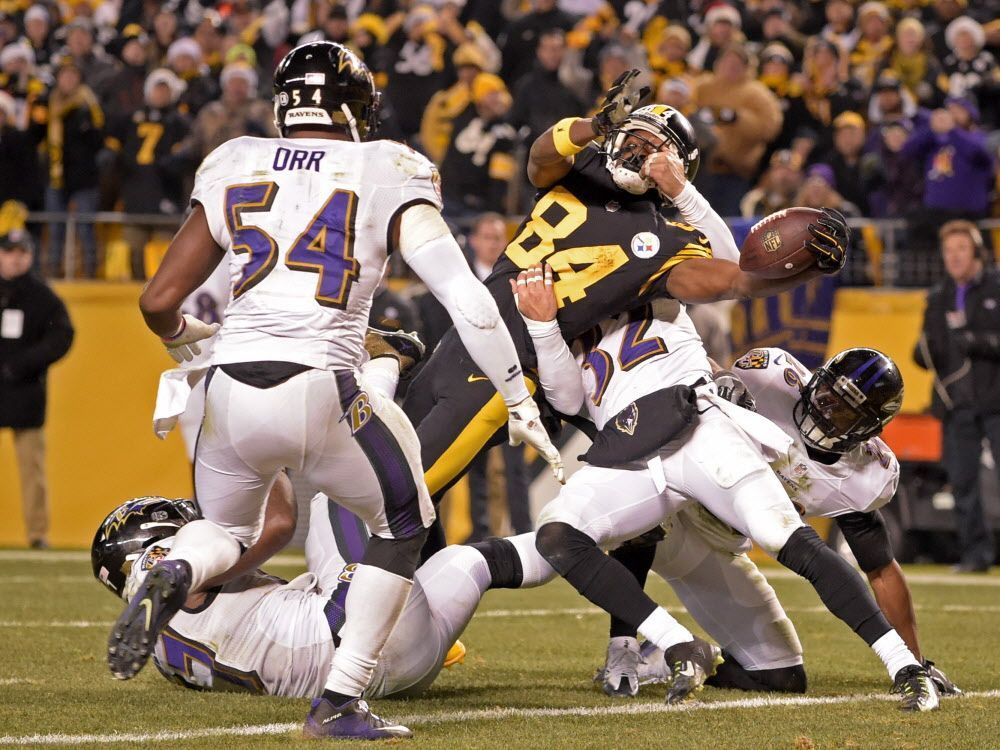 Steelers wide-receiver Antonio Brown reaches the ball across the goal line for a touchdown against the Baltimore Ravens in Pittsburgh on Sunday Dec. 25 2016. The Steelers won 31-27