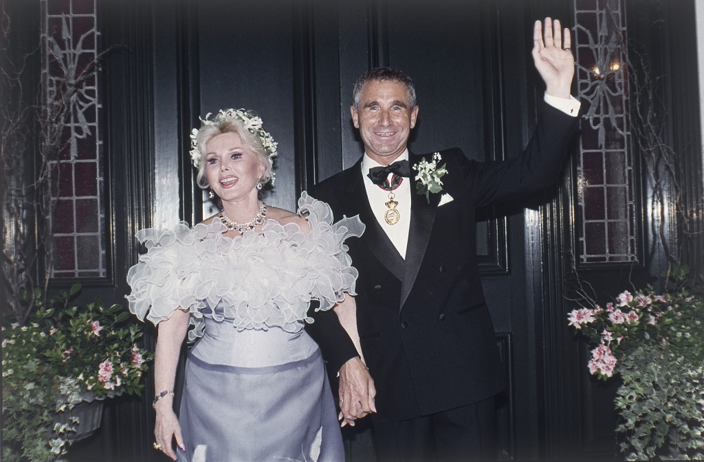 Zsa Zsa Gabor with her eighth husband Prince Fredrick von Anhalt at her home in the Bel Air section of Los Angeles after their wedding at an evening ceremony on Aug. 14,1986. Gabor wears a lavender and white off-the-shoulder gown. (AP