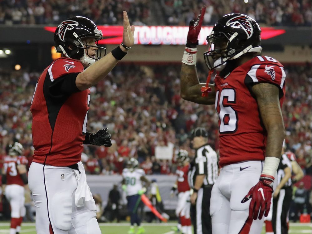 Matt Ryan #2 of the Atlanta Falcons and Justin Hardy #16 of the Atlanta Falcons react against the Seattle Seahawks at the Georgia Dome