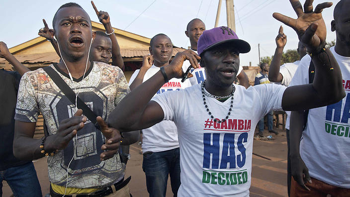 Gambians cheer in Serrekunda Gambia Thursday Jan. 19 2017 after watching Adama Barrow be sworn in as Gambian President