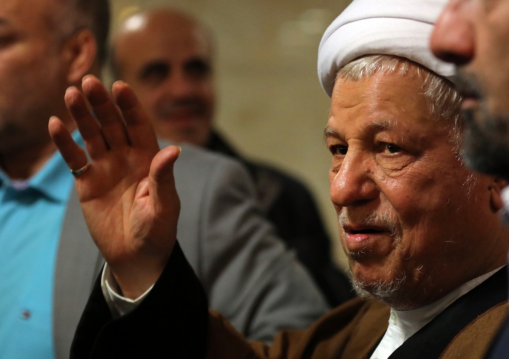 Iranian former president and head of the Expediency Council Akbar Hashemi Rafsanjani waves as he registers his candidacy for the upcoming Assembly of Experts elections at the interior ministry in Tehran