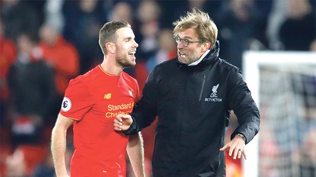 Liverpool manager Juergen Klopp with Jordan Henderson after the 4-1 win over Stoke City