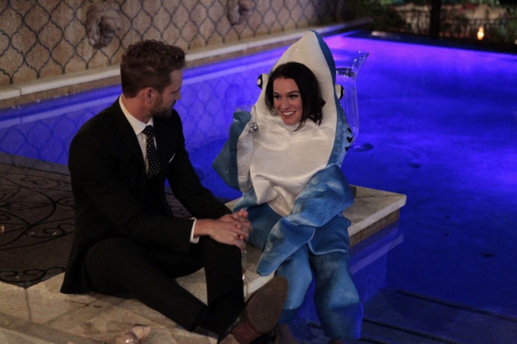 Nick Viall talks with Alexis a dolphin lover in a shark costume on the Season 21 premiere of The Bachelor