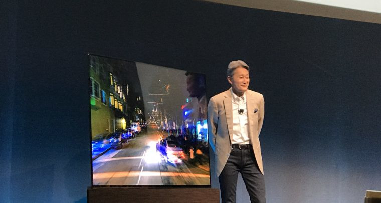 Sony chief executive Kaz Hiari with the company's latest OLED TV