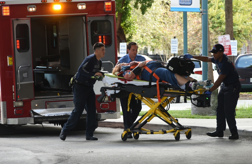 An injured woman is taken into Broward Health Trauma Center in Fort Lauderdale Fla. after a shooting at the Fort Lauderdale Hollywood International Airport on Friday Jan. 6 2017. Authorities say a lone shooter opened fire at the airport Friday afterno