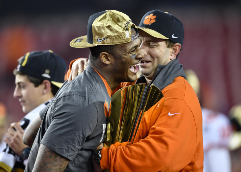 TAMPA FL- JANUARY 09 Clemson University head coach Dabo Swinney and Clemson University quarterback Deshaun Watson have a laugh during the awards ceremony after the CFP National Championship game between the Alabama Crimson Tide and the Clemson Tige