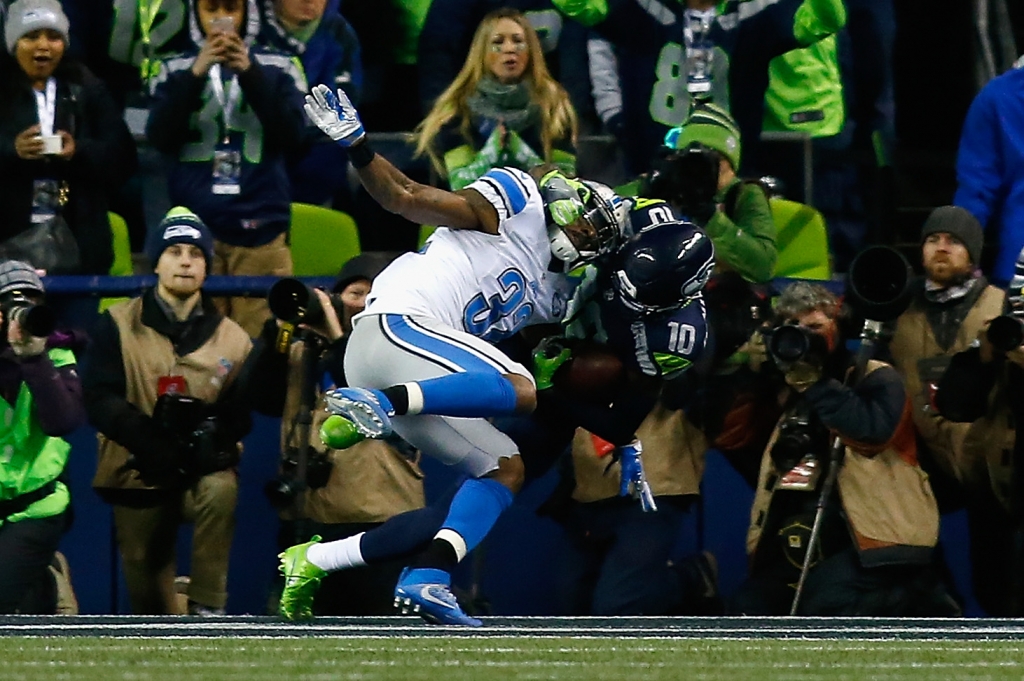 SEATTLE WA- JANUARY 07 Paul Richardson #10 of the Seattle Seahawks makes a touchdown catch against Tavon Wilson #32 of the Detroit Lions during the second quarter of the NFC Wild Card game at Century Link Field