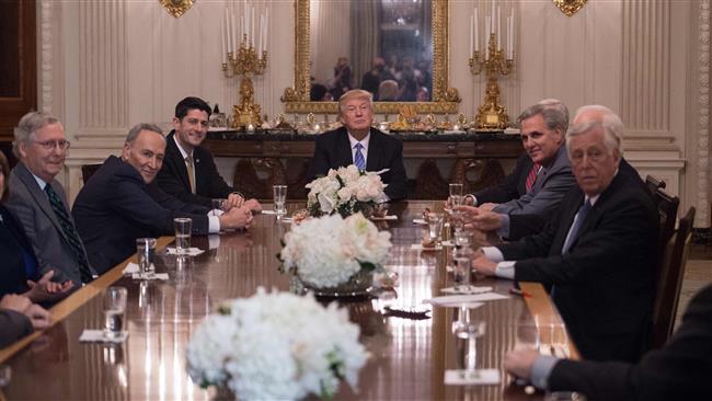 US President Donald Trump smiles during a reception with Congressional leaders including Senate Majority Leader Mitch Mc Connell, Senate Minority Leader Chuck Schumer and House Speaker Paul Ryan, House Minority Whip Steny Hoyer and